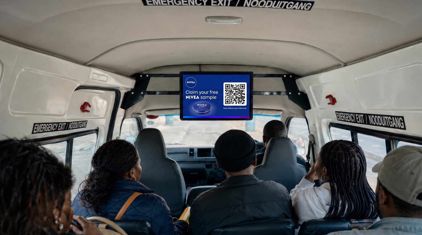 Taxi TV screen showing a NIVEA scan-to-claim QR offer inside a minibus taxi