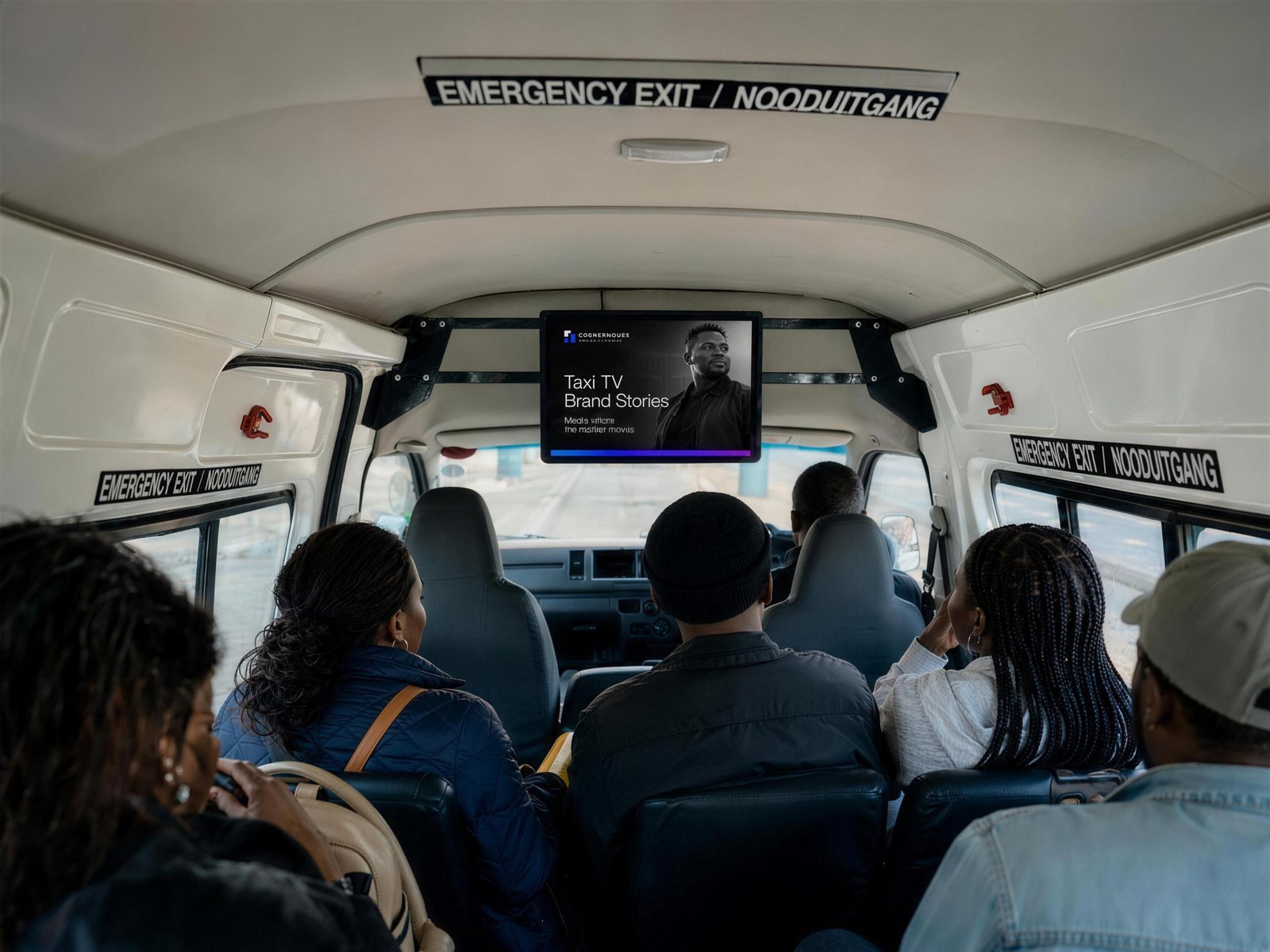 Roof-mounted Taxi TV screen showing Cornerhouse Brand Stories inside a minibus taxi