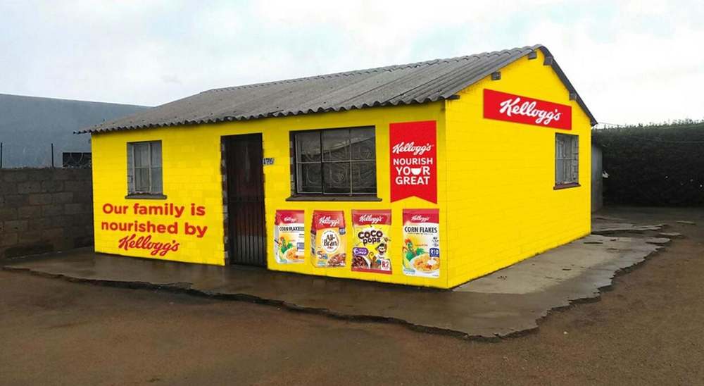 Family home wrapped in yellow Kellogg's branding reading our family is nourished by Kellogg's