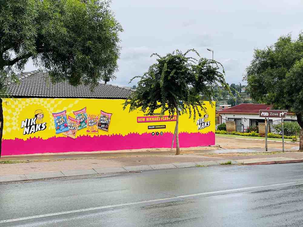 NikNaks corner wall takeover on a wet township street
