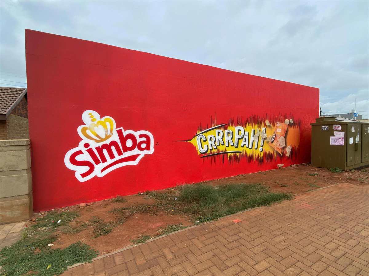 Red Simba CRRR-PAH! wall mural with painted chips bursting from a packet