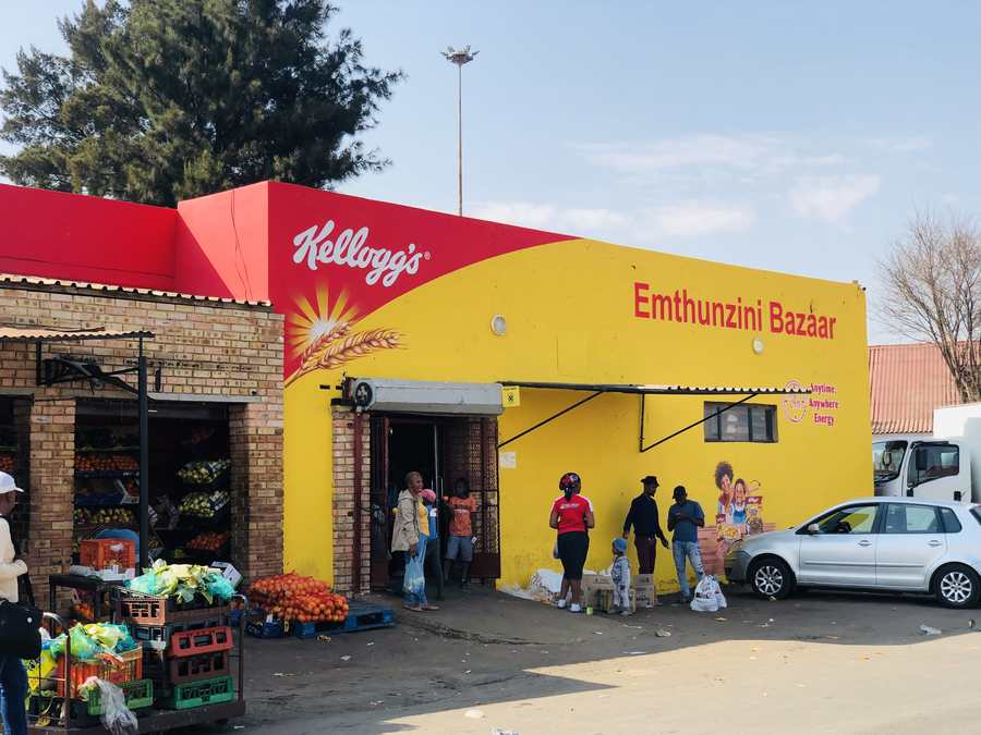 Kellogg's Emthunzini Bazaar storefront with shoppers at the entrance